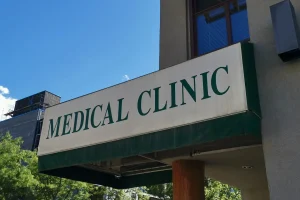 awning sign with green lettering on white background for a medical clinic