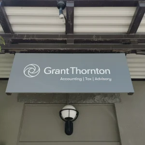 Black awning with white vinyl lettering for an accounting firm