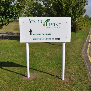 sign panel installed on grass, giving directions to visitors and deliveries