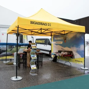 a custom print trade show tent with backwall and literature stand