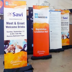 four roll up banners adverting an event