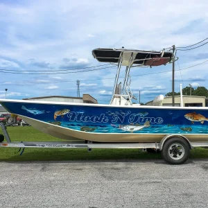 A speed boat outside on a trailer.
