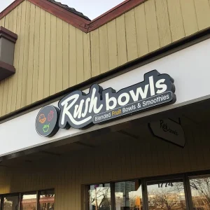 Custom shaped channe letter sign for a restaurant installed on the storefront.