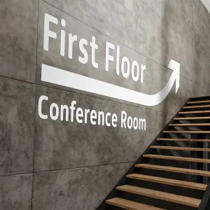 First Floor Conference Room sign with arrow pointing upwards.