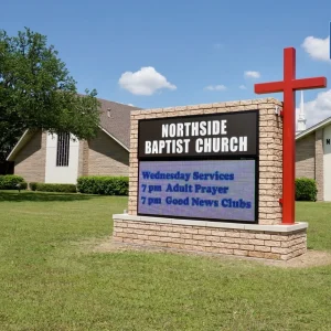A church monument sign with an electronic sign board built in.