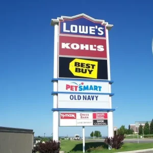 A pylon sign with many large box store signage.
