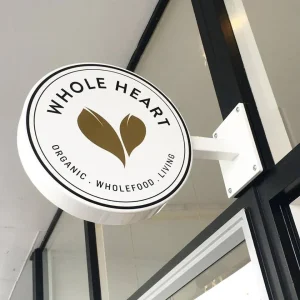 A circular blade sign for a organic food store.
