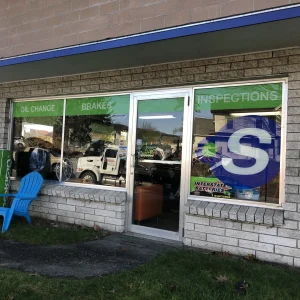 Partial window graphics on the exterior of a business.