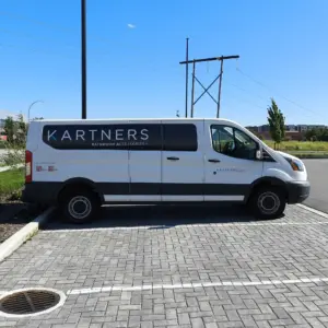 A long work van with vinyl graphics for a bathroom accessories company